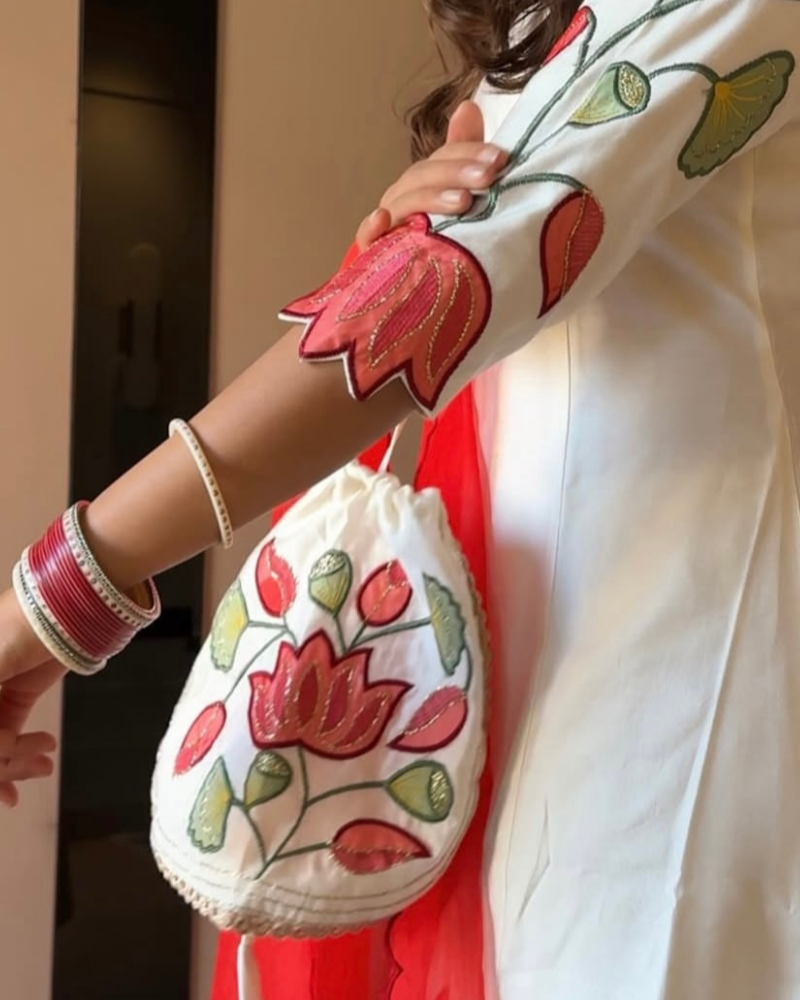 WHITE SUIT WITH POTLI